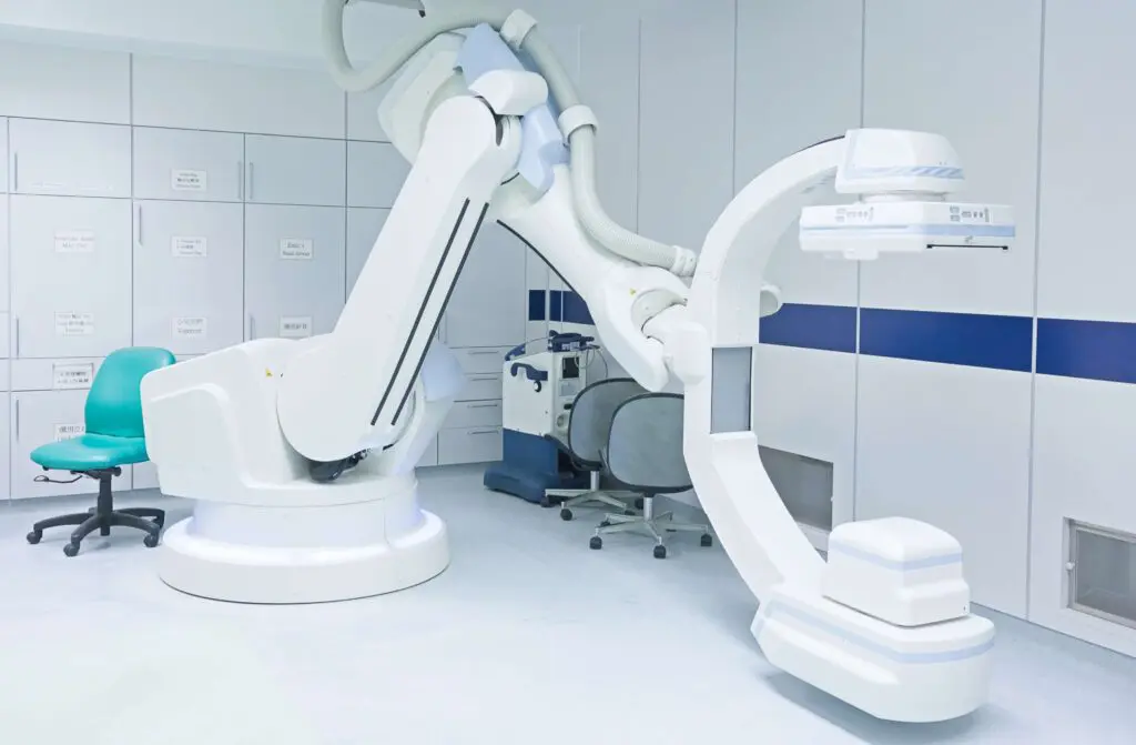 Modern medical imaging equipment in hospital room.